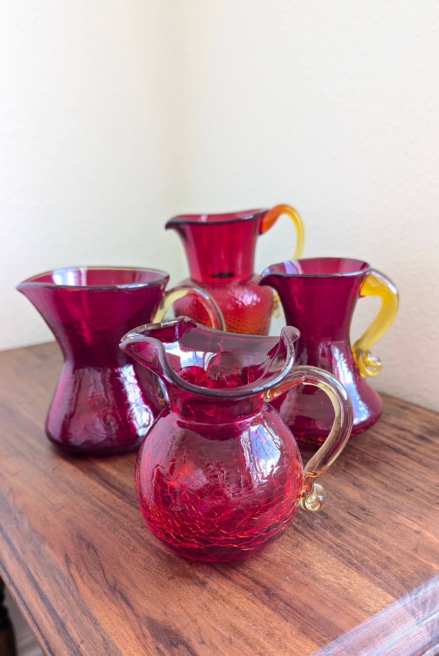Collection of Red/ Amberina Crackle and Textured Art Glass Pitchers (set of 4)