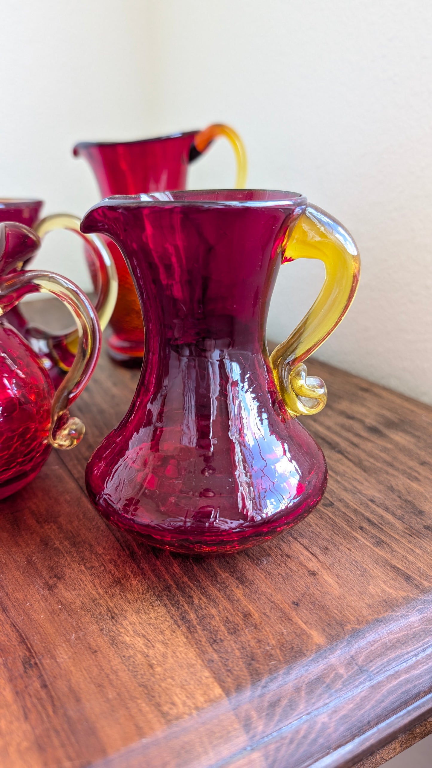Collection of Red/ Amberina Crackle and Textured Art Glass Pitchers (set of 4)
