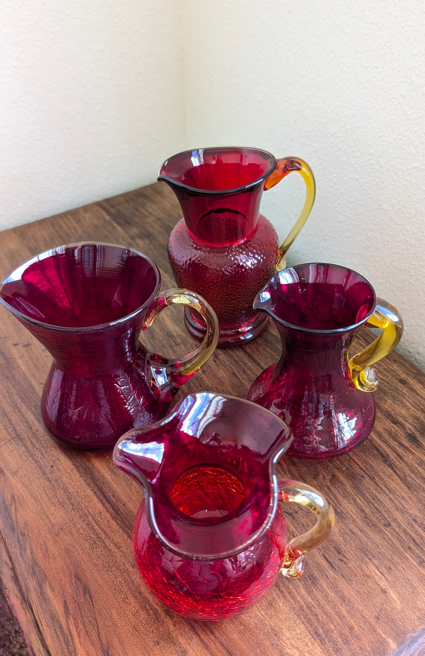 Collection of Red/ Amberina Crackle and Textured Art Glass Pitchers (set of 4)