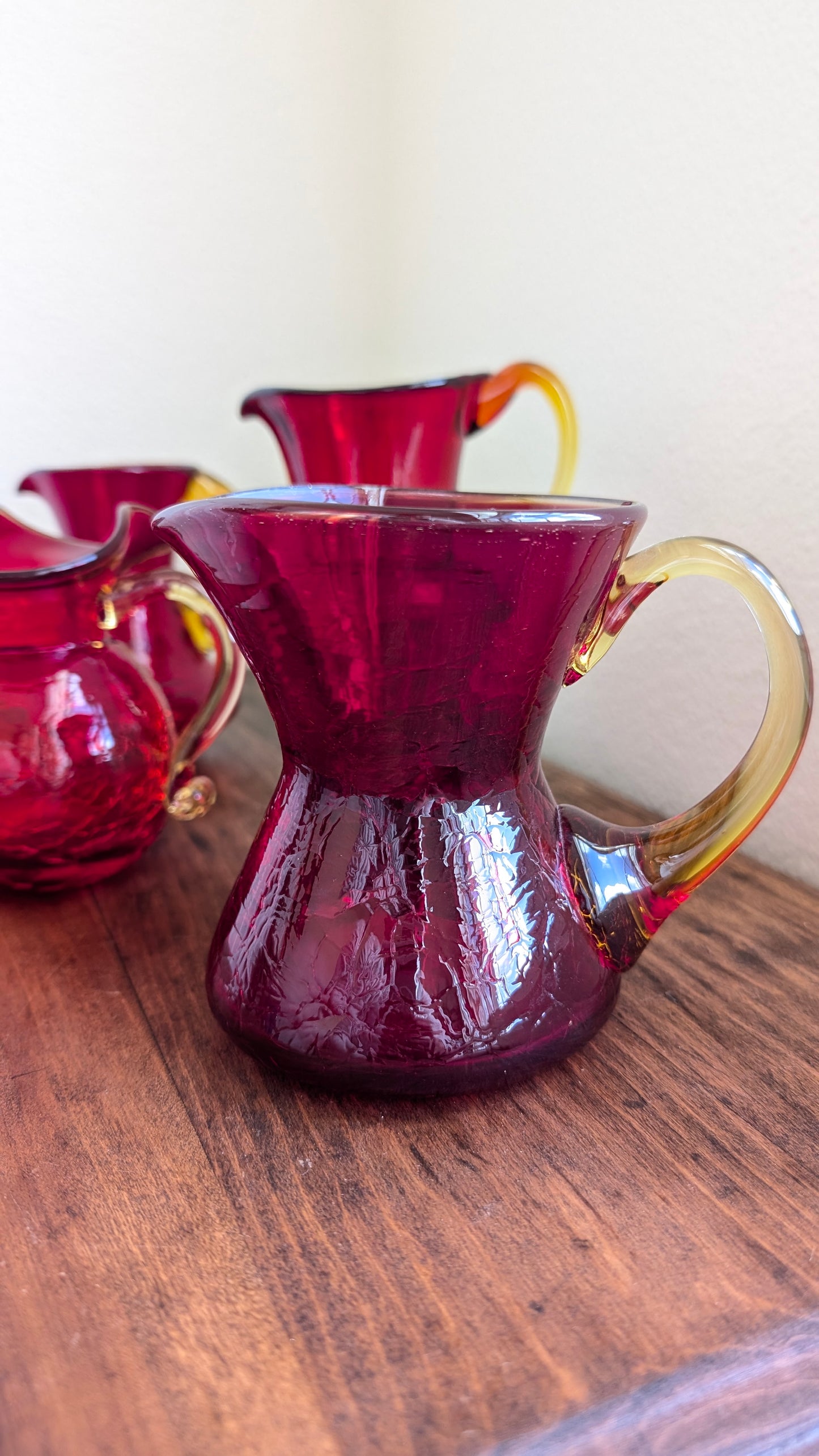 Collection of Red/ Amberina Crackle and Textured Art Glass Pitchers (set of 4)