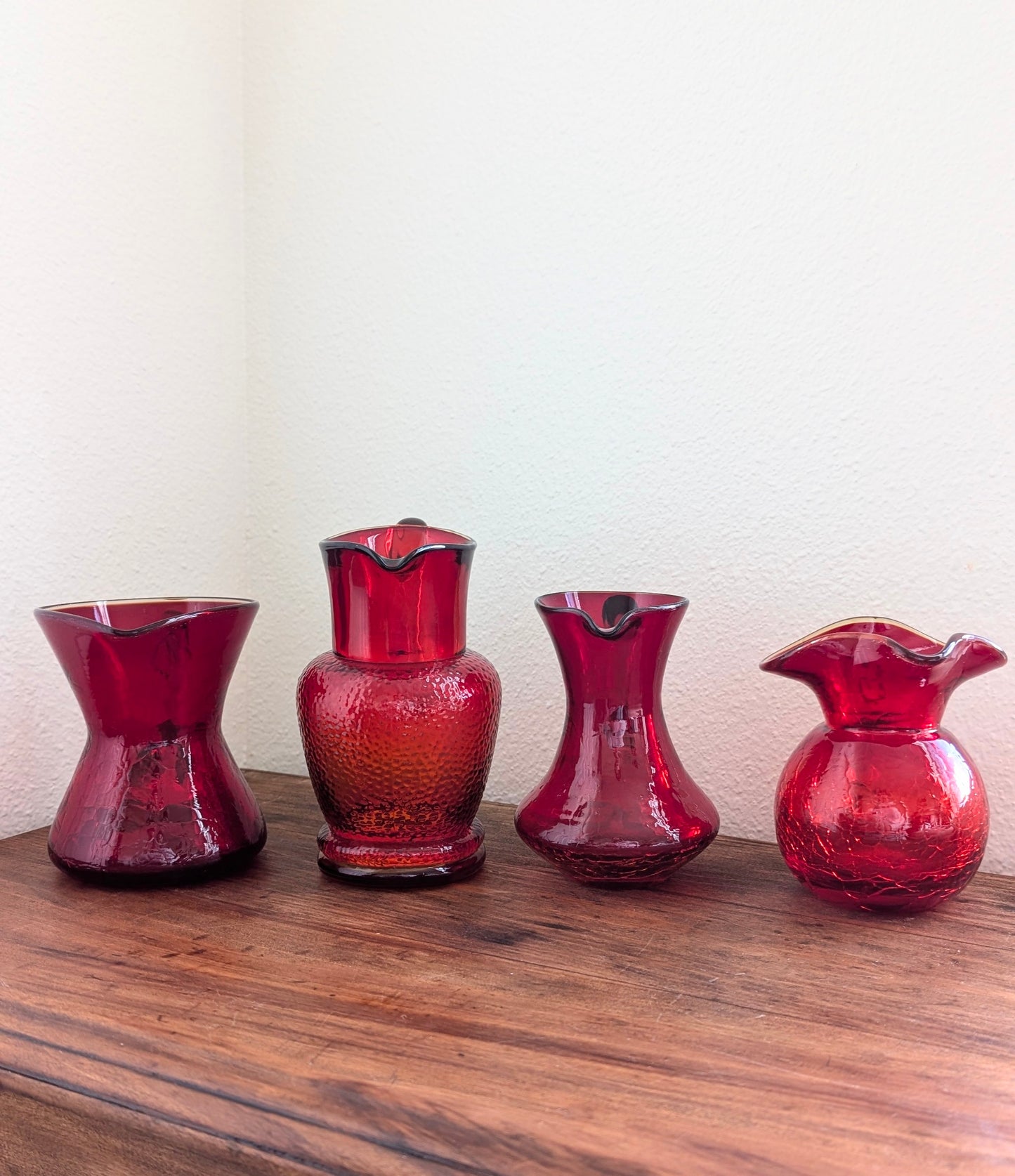 Collection of Red/ Amberina Crackle and Textured Art Glass Pitchers (set of 4)